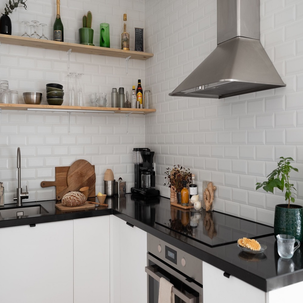 white kitchen cabinets with black countertops