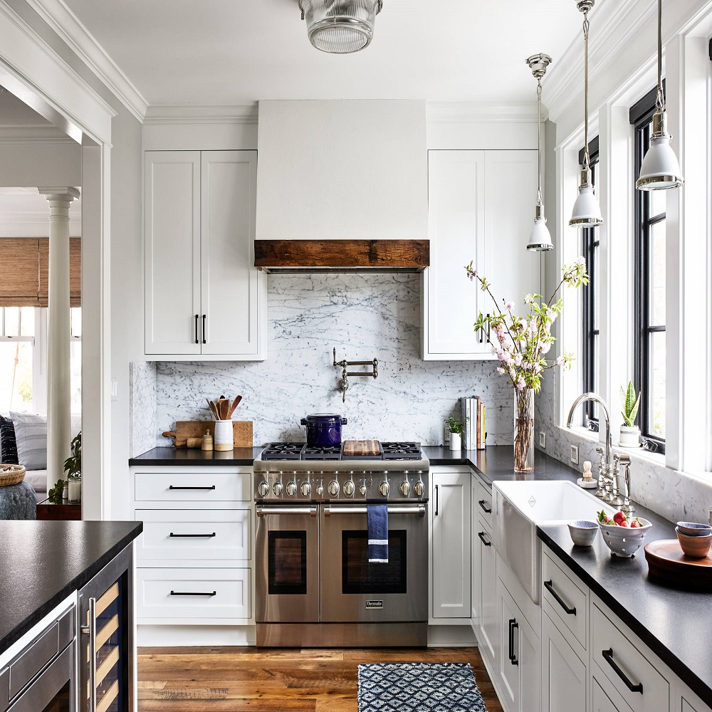 white kitchen cabinets with black countertops